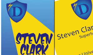 Business card design: blue shield with a yellow searchlight emanating from it.