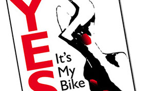 Logo depicting a woman's hand with red nails holding a wrench with the text "Yes It's My Bike"